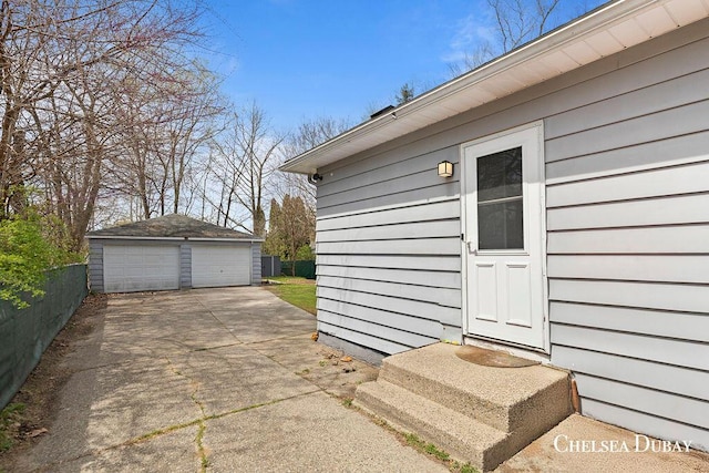 exterior space with a garage and fence