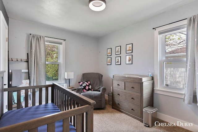 carpeted bedroom with baseboards