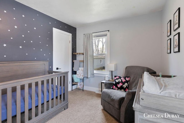 carpeted bedroom featuring baseboards