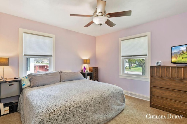 bedroom featuring baseboards, ceiling fan, and carpet flooring
