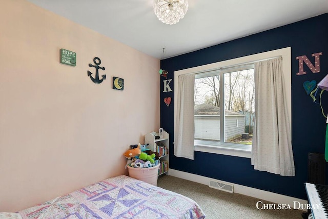 bedroom with carpet floors and visible vents