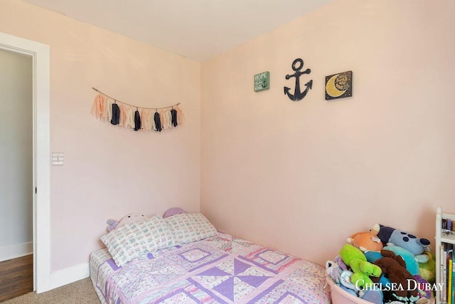 bedroom featuring baseboards