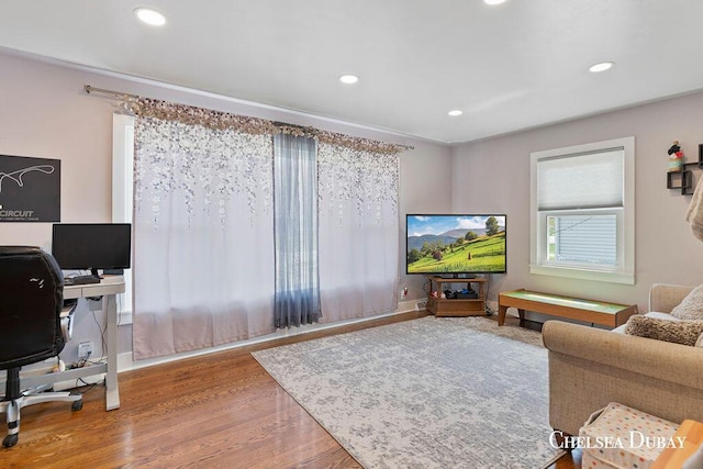living room featuring recessed lighting and wood finished floors
