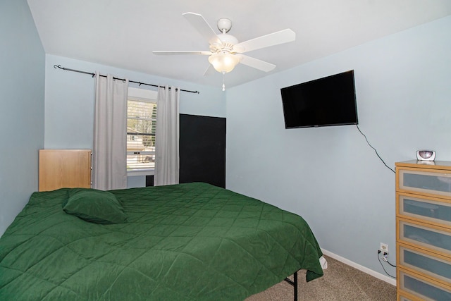 bedroom with carpet floors, baseboards, and a ceiling fan