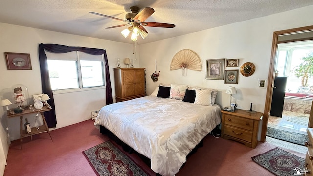 7736 S Custer Rd, Monroe, MI 48161 - bedroom featuring ceiling fan, carpet flooring, and a textured ceiling