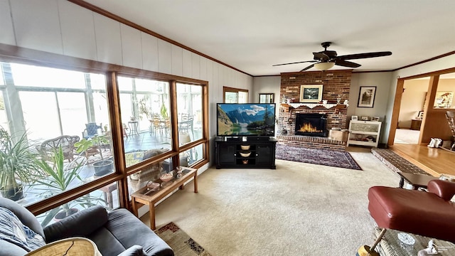 7736 S Custer Rd, Monroe, MI 48161 - carpeted living area with crown molding, a ceiling fan, and a fireplace