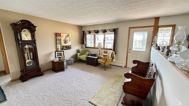 7736 S Custer Rd, Monroe, MI 48161 - living area featuring a textured ceiling, light carpet, baseboards, and a baseboard radiator