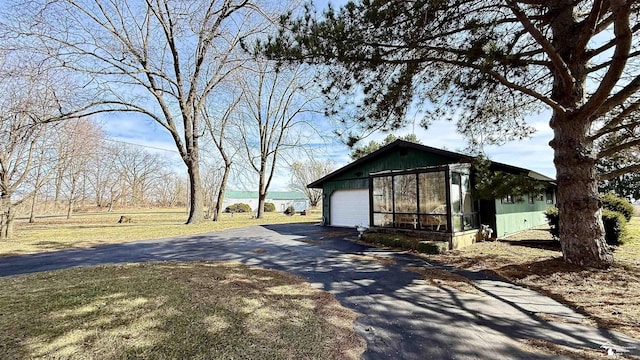 7736 S Custer Rd, Monroe, MI 48161 - view of front of property with driveway, an outbuilding, and a garage