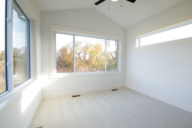 unfurnished room with carpet flooring, ceiling fan, visible vents, and lofted ceiling