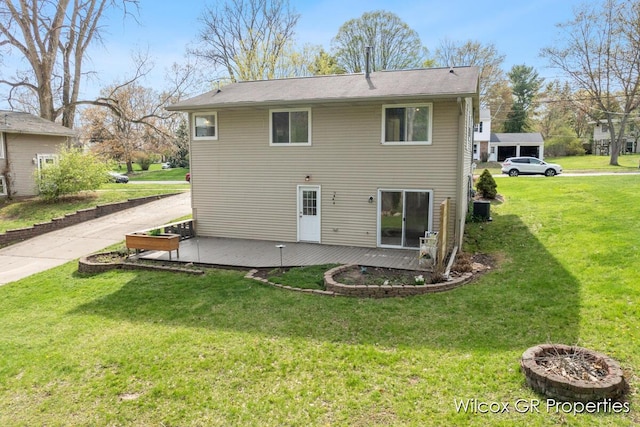 back of property featuring a lawn, a wooden deck, and central AC unit