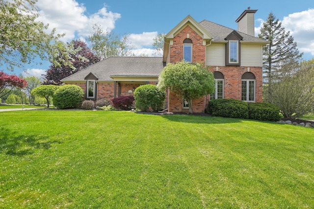 1373 Prosper Dr, Troy, MI 48098 - traditional-style home with brick siding, a front yard, a chimney, and a shingled roof