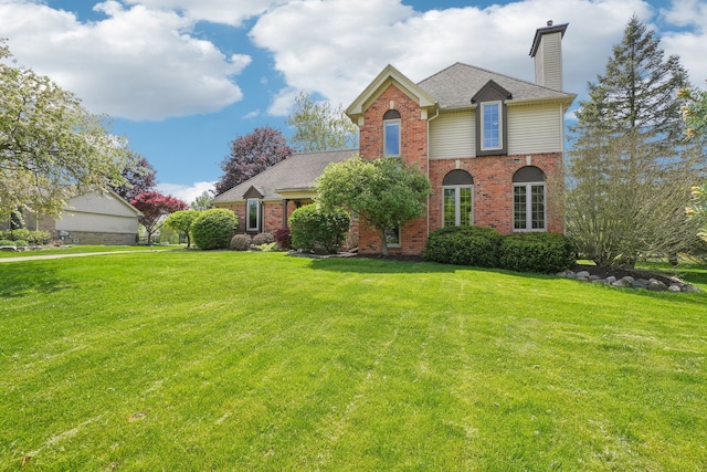 1373 Prosper Dr, Troy, MI 48098 - traditional-style home with a chimney, brick siding, a front lawn, and a shingled roof