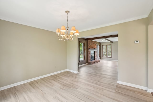 1373 Prosper Dr, Troy, MI 48098 - unfurnished dining area with baseboards, light wood-type flooring, a chandelier, and crown molding