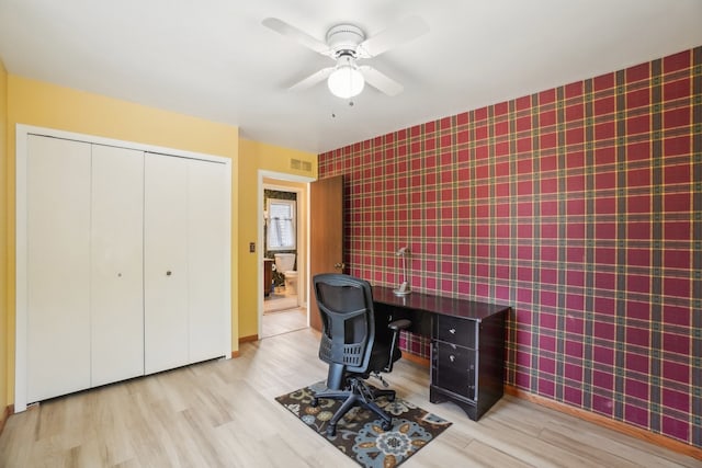 1373 Prosper Dr, Troy, MI 48098 - office featuring wallpapered walls, wood finished floors, an accent wall, ceiling fan, and baseboards