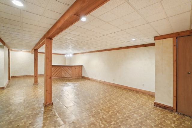 1373 Prosper Dr, Troy, MI 48098 - finished below grade area featuring baseboards and a paneled ceiling