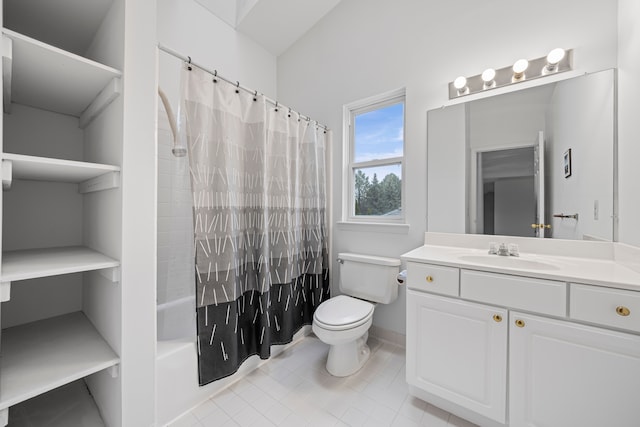 full bath featuring toilet, tile patterned floors, vanity, and shower / tub combo