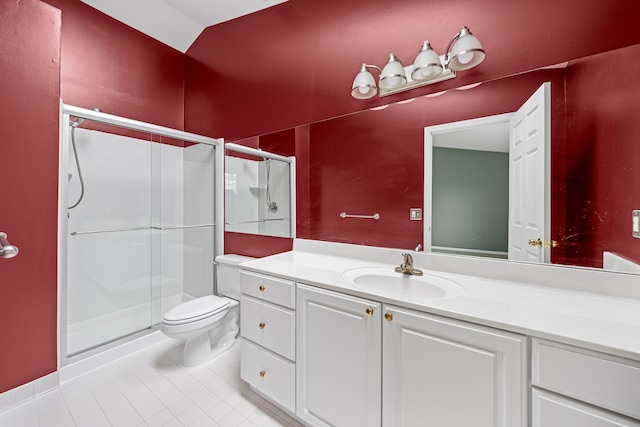 full bath featuring a shower stall, tile patterned flooring, vanity, and toilet