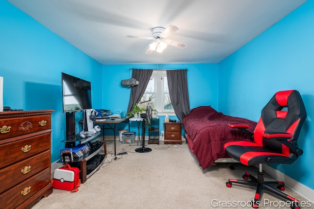 bedroom with carpet floors, a ceiling fan, and baseboards