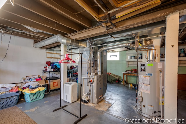 below grade area featuring heating unit and water heater