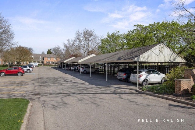 view of partially covered parking lot