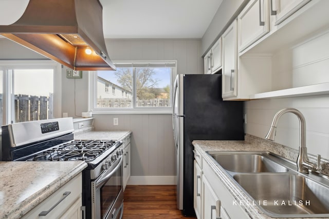 kitchen featuring island exhaust hood, a sink, white cabinets, dark wood-style floors, and stainless steel appliances