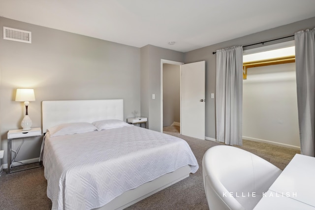bedroom with carpet floors, baseboards, a closet, and visible vents