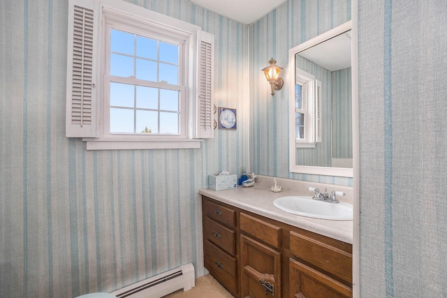 3500 N Oceana Dr, Hart, MI 49420 - bathroom featuring vanity, baseboard heating, and wallpapered walls
