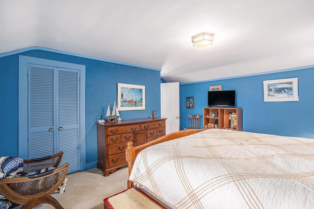 3500 N Oceana Dr, Hart, MI 49420 - bedroom with vaulted ceiling, a closet, and light colored carpet