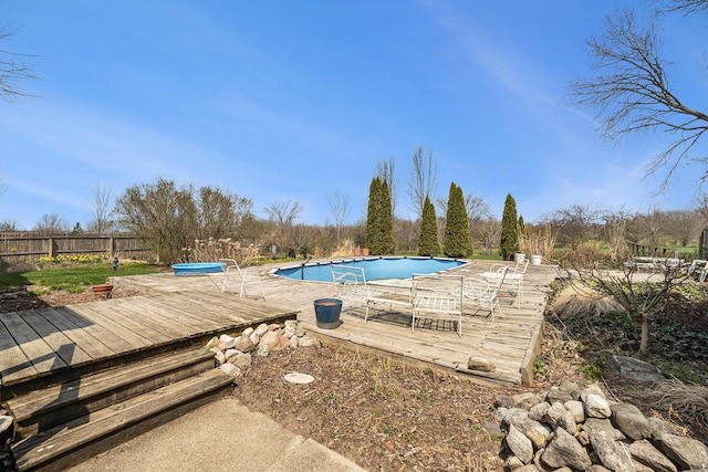 3500 N Oceana Dr, Hart, MI 49420 - view of swimming pool featuring fence, a wooden deck, and a covered pool