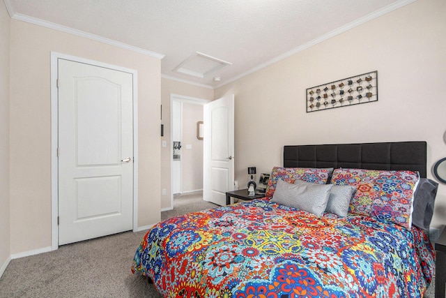bedroom featuring carpet flooring, crown molding, baseboards, and attic access