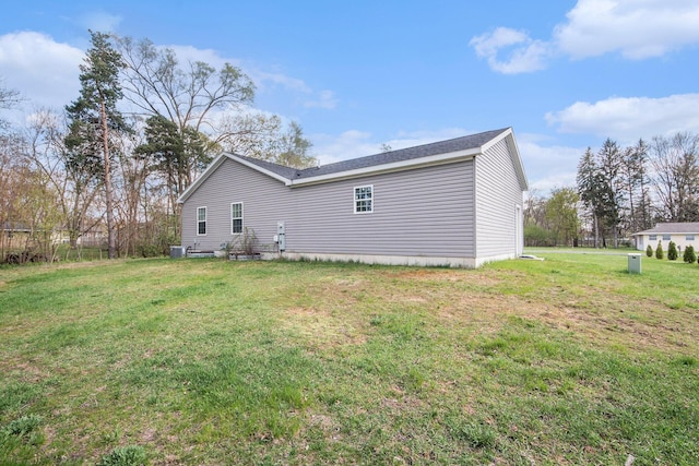 back of property with a yard