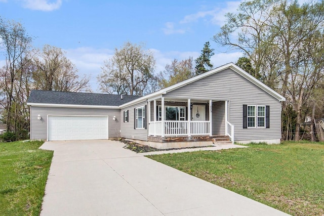 525 66th St SE, Grand Rapids, MI 49548 - view of front of house with covered porch, driveway, an attached garage, and a front lawn
