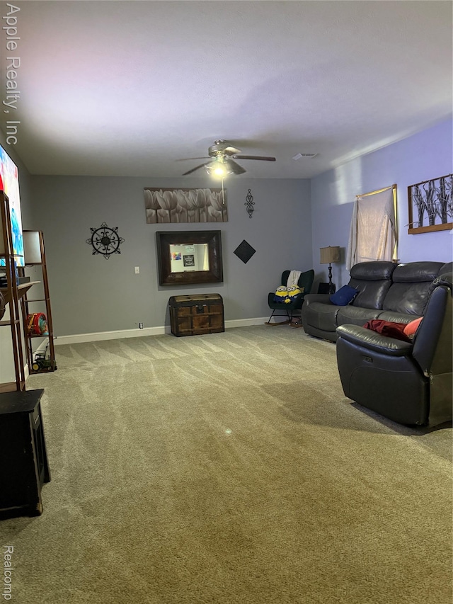 510 Maple St, Leslie, MI 49251 - living room with carpet flooring, a ceiling fan, and baseboards