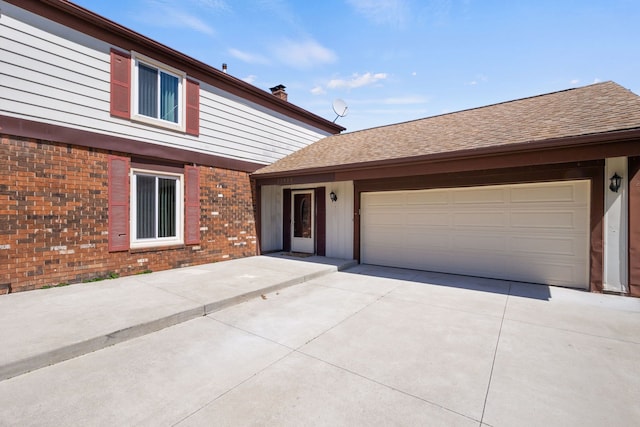 35490 Hatherly Dr, Sterling Heights, MI 48310 - view of front of house with a garage, concrete driveway, roof with shingles, and brick siding