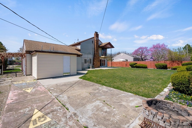 35490 Hatherly Dr, Sterling Heights, MI 48310 - exterior space featuring a yard, fence, a patio area, and an outdoor fire pit