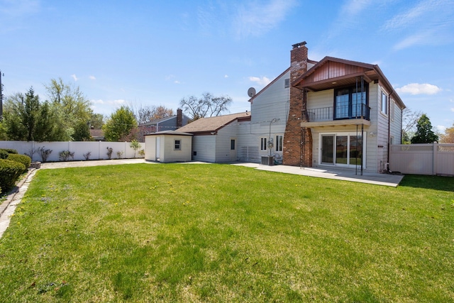 35490 Hatherly Dr, Sterling Heights, MI 48310 - rear view of property featuring a fenced backyard, a chimney, a patio area, a balcony, and a lawn