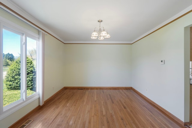 35490 Hatherly Dr, Sterling Heights, MI 48310 - spare room with crown molding, baseboards, a chandelier, and light wood-type flooring
