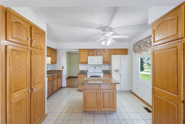 35490 Hatherly Dr, Sterling Heights, MI 48310 - kitchen with visible vents, white appliances, ceiling fan, a center island, and tasteful backsplash