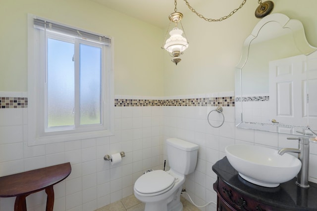 35490 Hatherly Dr, Sterling Heights, MI 48310 - half bath with tile walls, a wainscoted wall, vanity, and toilet