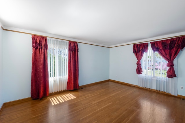35490 Hatherly Dr, Sterling Heights, MI 48310 - unfurnished room with crown molding, baseboards, and wood finished floors