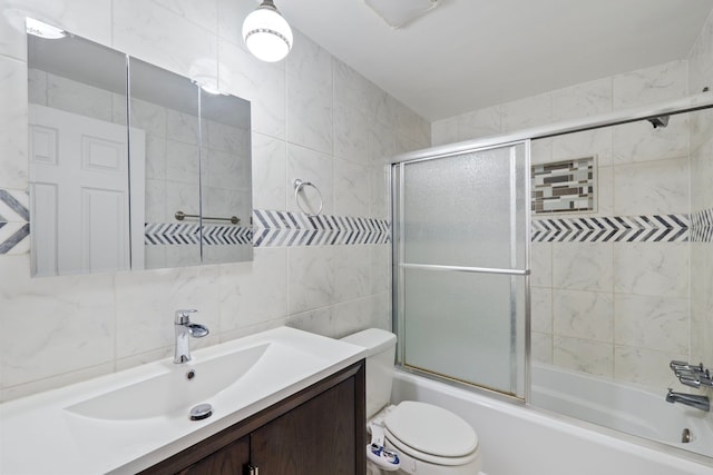 35490 Hatherly Dr, Sterling Heights, MI 48310 - full bathroom with vanity, toilet, tile walls, backsplash, and bath / shower combo with glass door