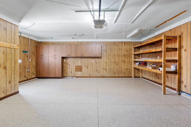 35490 Hatherly Dr, Sterling Heights, MI 48310 - basement featuring baseboards, wood walls, and a garage