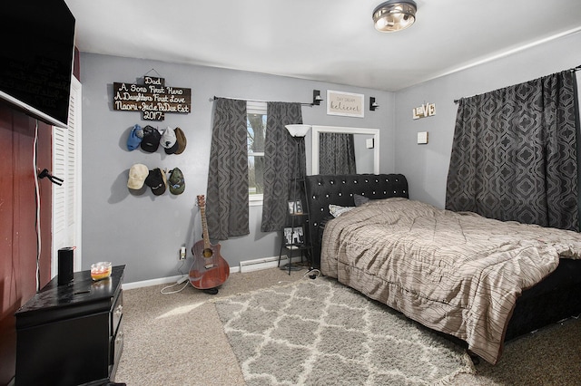 carpeted bedroom featuring baseboards