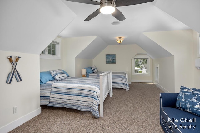 bedroom featuring carpet floors, baseboards, vaulted ceiling, and ceiling fan