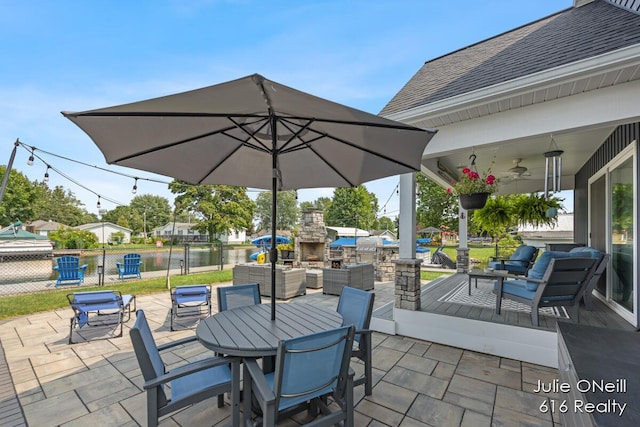 view of patio featuring fence, a ceiling fan, outdoor dining area, and an outdoor living space