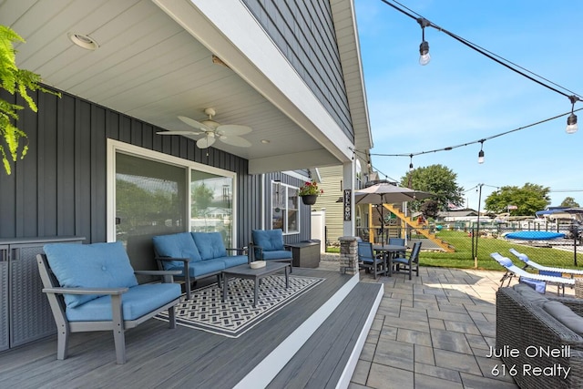 view of patio with outdoor dining area, a ceiling fan, fence, and an outdoor hangout area