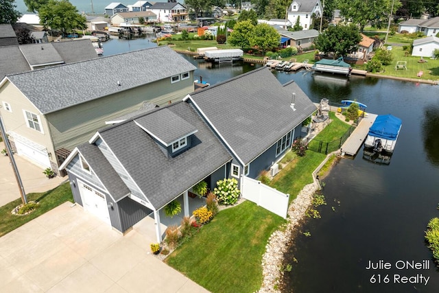 bird's eye view with a residential view and a water view