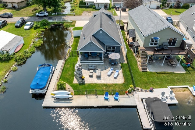 bird's eye view featuring a water view and a residential view
