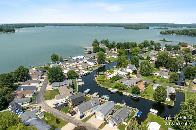 aerial view featuring a residential view and a water view