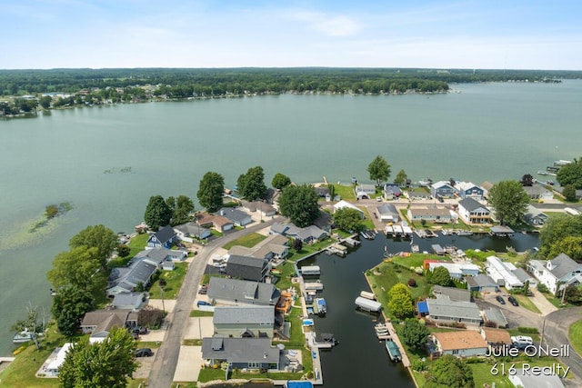 bird's eye view with a water view and a residential view